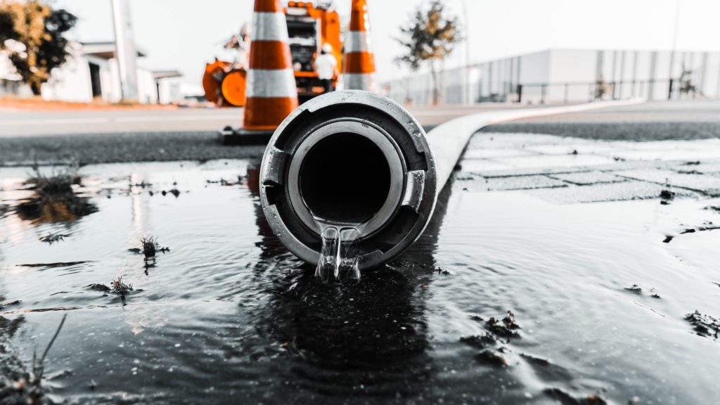 "Water coming out of pipe" Photo by Daan Mooij on Unsplash